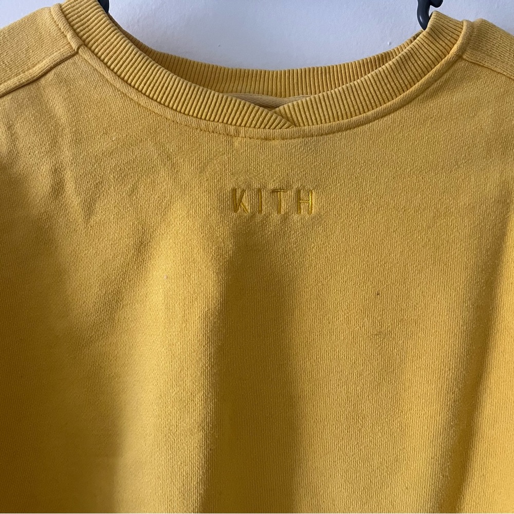 Kith women’s yellow cropped crewneck with a slit open back